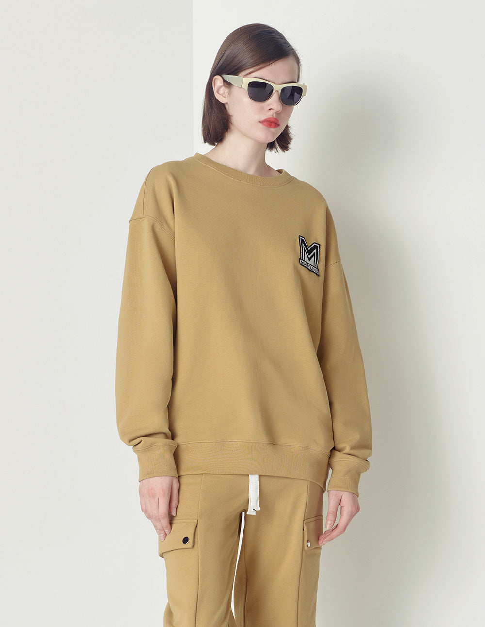 Maryling Beige Loose Design M Badge Sweater
